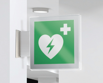 SEPE15156BW - targa Plexi bifacciale Defribillatore EN ISO 7010 E010